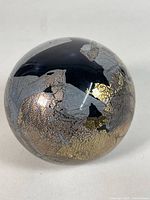 Spherical paperweight front view showing gold and silver crackle design