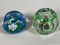 Both Perthshire paperweights side by side