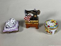 Group shot of three Limoges porcelain trinket boxes