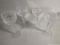 Four Waterford cut crystal stemware glasses, group view