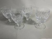 Four Waterford cut crystal stemware glasses group shot