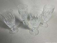 Four Waterford crystal stemware glasses grouped