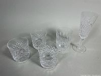 group shot of four tumblers and one flute