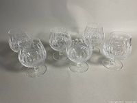 Set of six Waterford crystal brandy snifters displayed