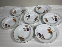 All seven Royal Worcester Evesham bowls arranged top view