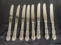 Eight Birks knives lined up showing full view