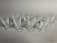 Lot overview showing all eight Waterford crystal stemware glasses