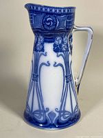 Full left-side view of pitcher showing pattern and shape