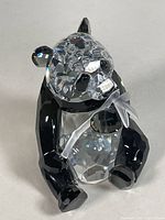 Front angled view of Swarovski crystal panda bear figurine