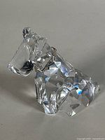 Left-front view of crystal terrier showing faceted body and rhodium collar