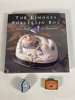 Overall lot showing reference book, round trinket box, rectangular "Shoes" box