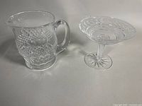 Pitcher and pedestal compote side by side