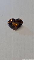 Heart-cut burnt orange zircon front view