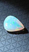 Pear-cut faceted Ethiopian opal showing color play