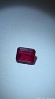 Front view of octagon-cut ruby showing color and cut