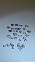 All loose tanzanite gemstones grouped on neutral background