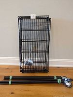 Disassembled shelving unit with shelves, posts and hardware