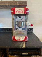Front view of popcorn machine showing overall design and condition