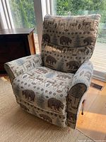 Full view of recliner showing overall design and fabric pattern