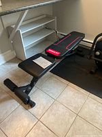 Full view of Magicfit adjustable dumbbell bench under counter
