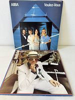 Front covers of ABBA Voulez-Vous and Elton John Greatest Hits vinyl albums
