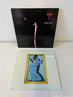 Front covers of both albums upright