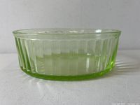Side view showing ribbed Vaseline uranium glass bowl