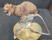 Front angled view of Franklin Mint resin cougar on glass base