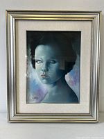 Frontal view of framed oil portrait