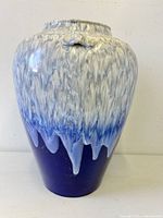 Front view of blue and white fat lava drip floor vase