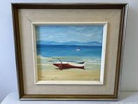 Front view of framed Langley seascape oil painting