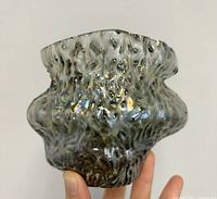Front view of textured iridescent glass vase