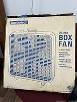 Original cardboard box showing Envirotech 20-inch box fan details