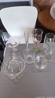 All nine glass pieces grouped on table
