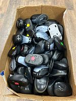 Box filled with assorted Logitech wireless mice