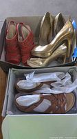 Four pairs of shoes in boxes showing overall lot