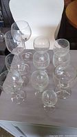 All 12 clear Bohemia Czech stemware pieces grouped on table