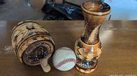 Barrel, vase and scale baseball