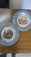 Both commemorative plates front view