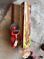 Overall view of hedge trimmer and box