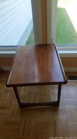 Top view of rectangular medium brown wood table