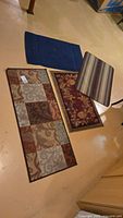 Group shot of all four rugs/mats laid out on floor