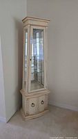 Full front view of curio cabinet showing doors, glass panels and overall condition