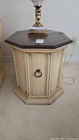 Full view of octagonal side table cabinet showing color, door, base