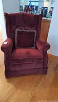 Front view of burgundy La-Z-Boy recliner with cushion