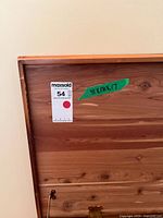 Interior lid showing cedar panels, dimensions tape, lot sticker