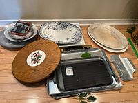 Group shot of all platters, trays, grill pan and spreaders