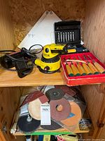 Overall view showing laser level, Proline sander, Mastercraft set, Millers Falls chisels, safety goggles and abrasive discs