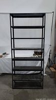 Full view of 8-shelf black metal shelving unit
