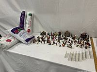 overall view of figurines, snow blanket packages, fencing